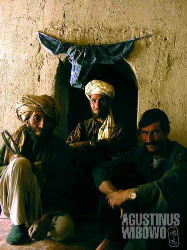 Three men in a mud house in Jar Sherwa, one of the poorest villages in the poor province of Ghour.