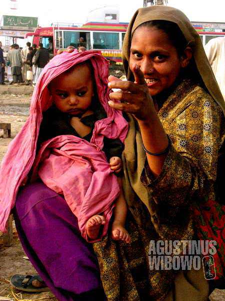 A woman beggar with her baby
